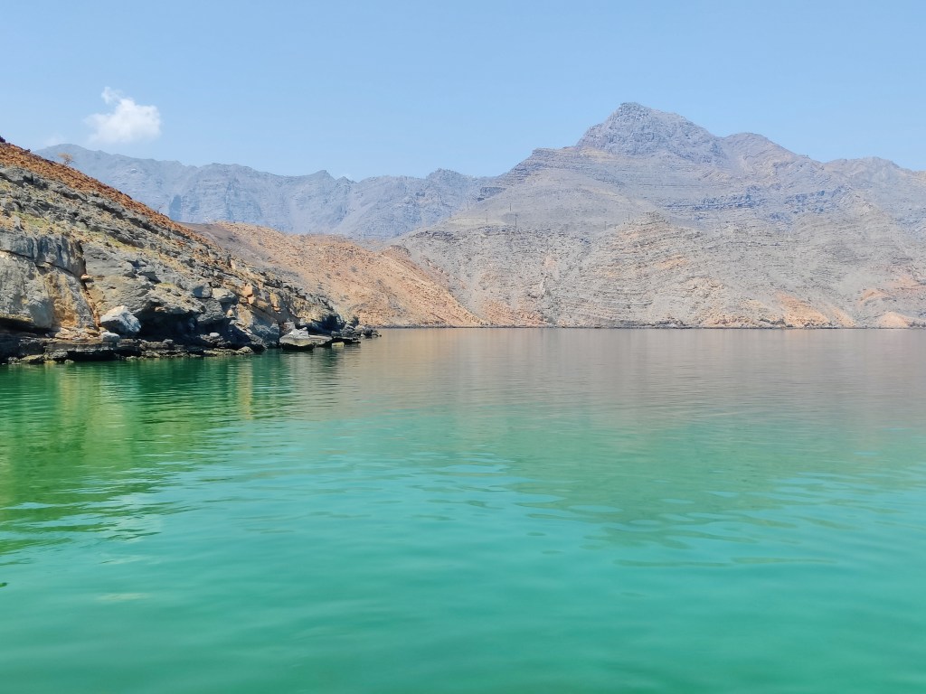 The amazing colors of the water and mountains in Musandam, Oman.