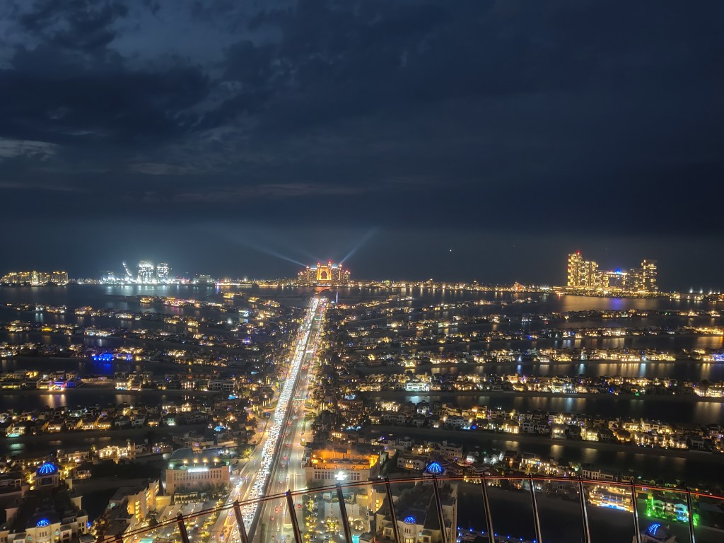 Equally stunning night aerial view of the palm with Atlantis the Royal visible on the right side of the breakwater